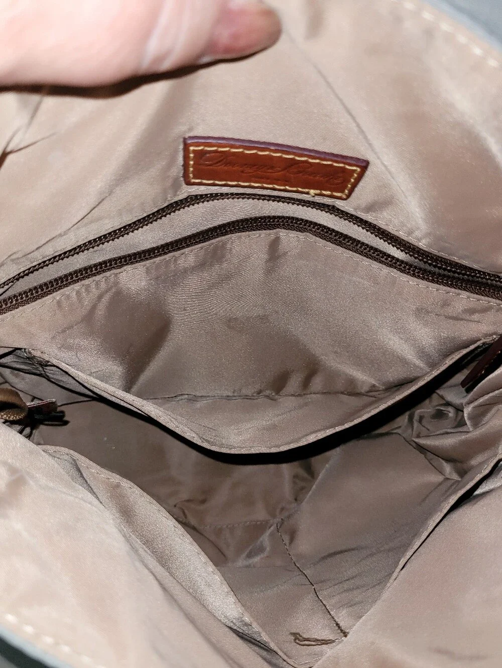 Dooney & Bourke Light Gray Nylon Backpack with Brown Leather Trim.